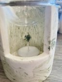 A tea light burner with a glass bowl